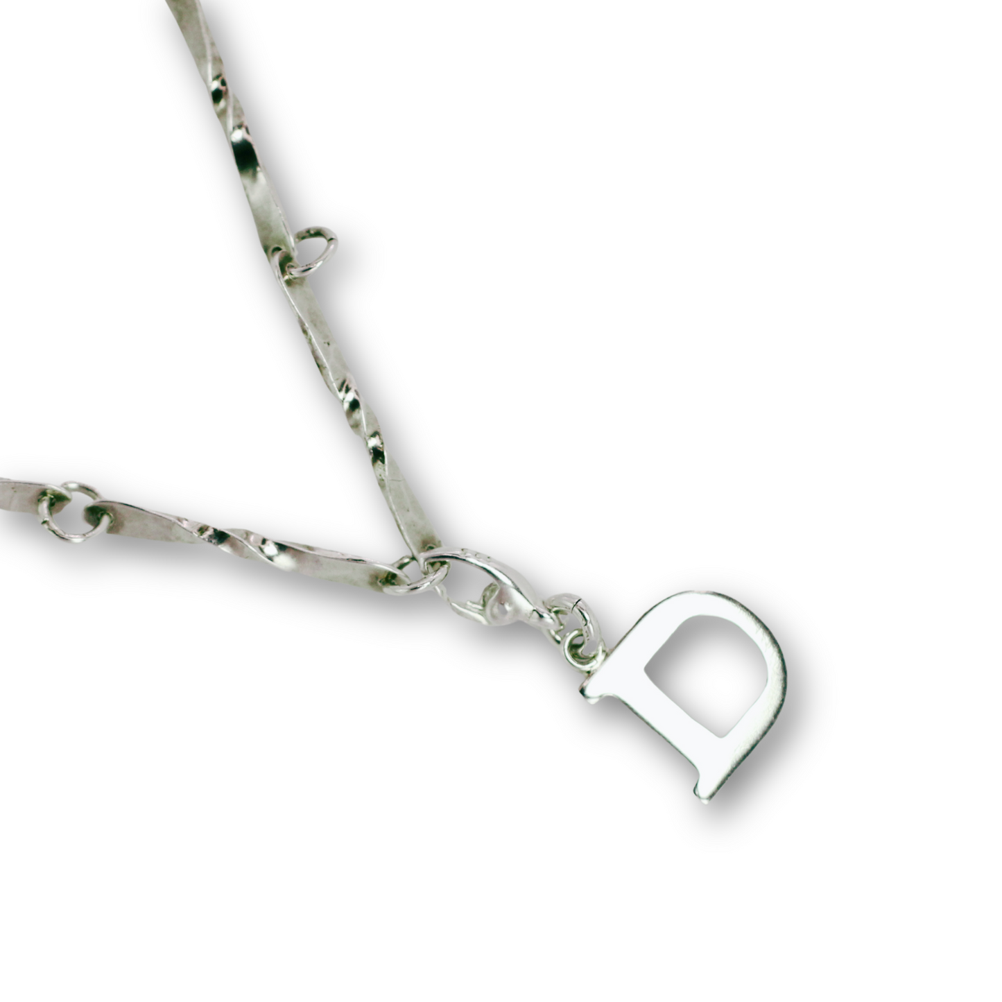 Handcrafted sterling silver letter D clip-on charm by Vijara jewelry.