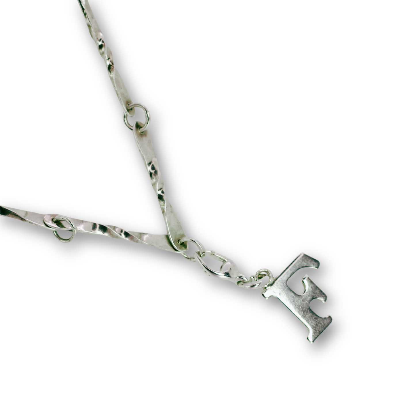 Handcrafted sterling silver letter F clip-on charm by Vijara jewelry.
