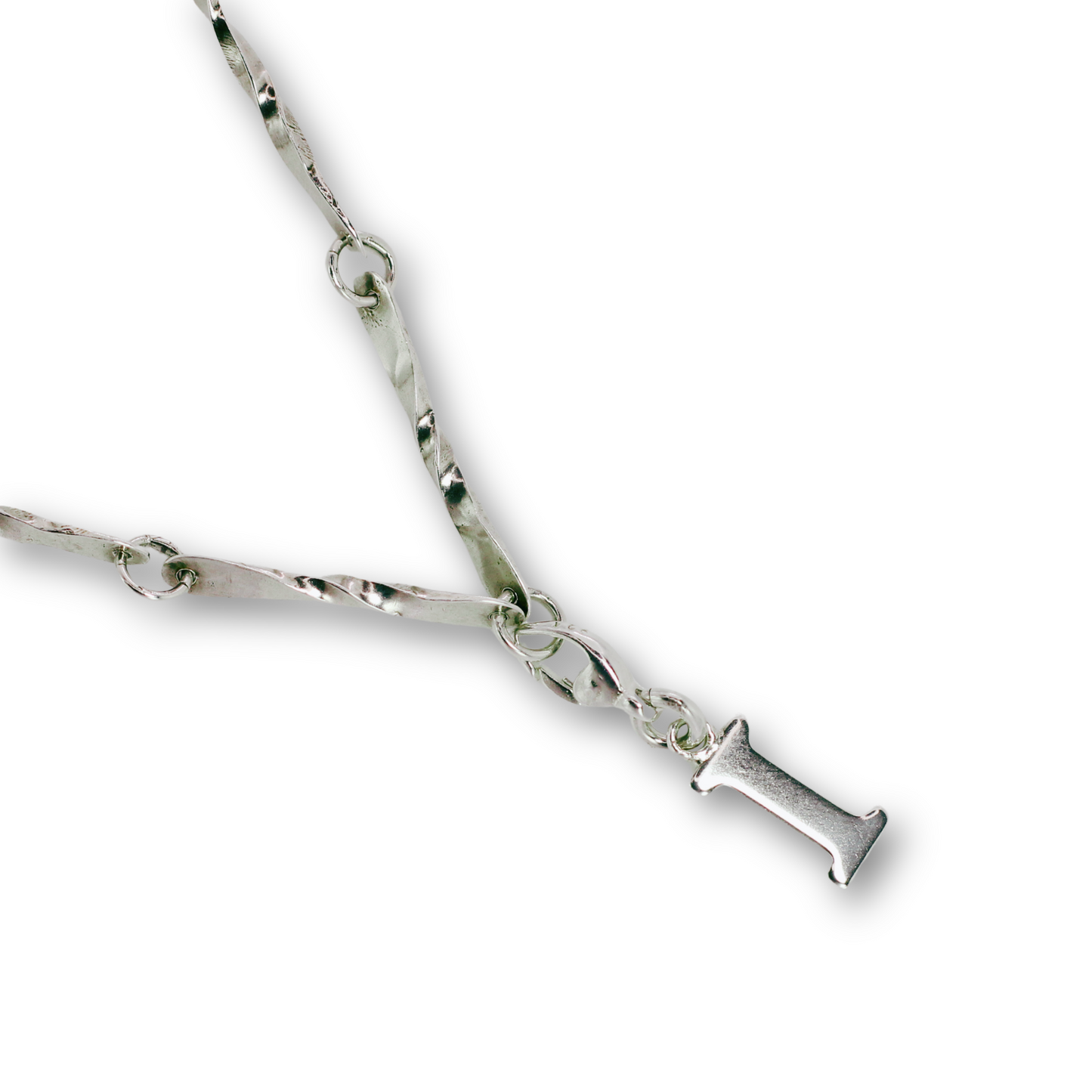 Handcrafted sterling silver letter I clip-on charm by Vijara jewelry.