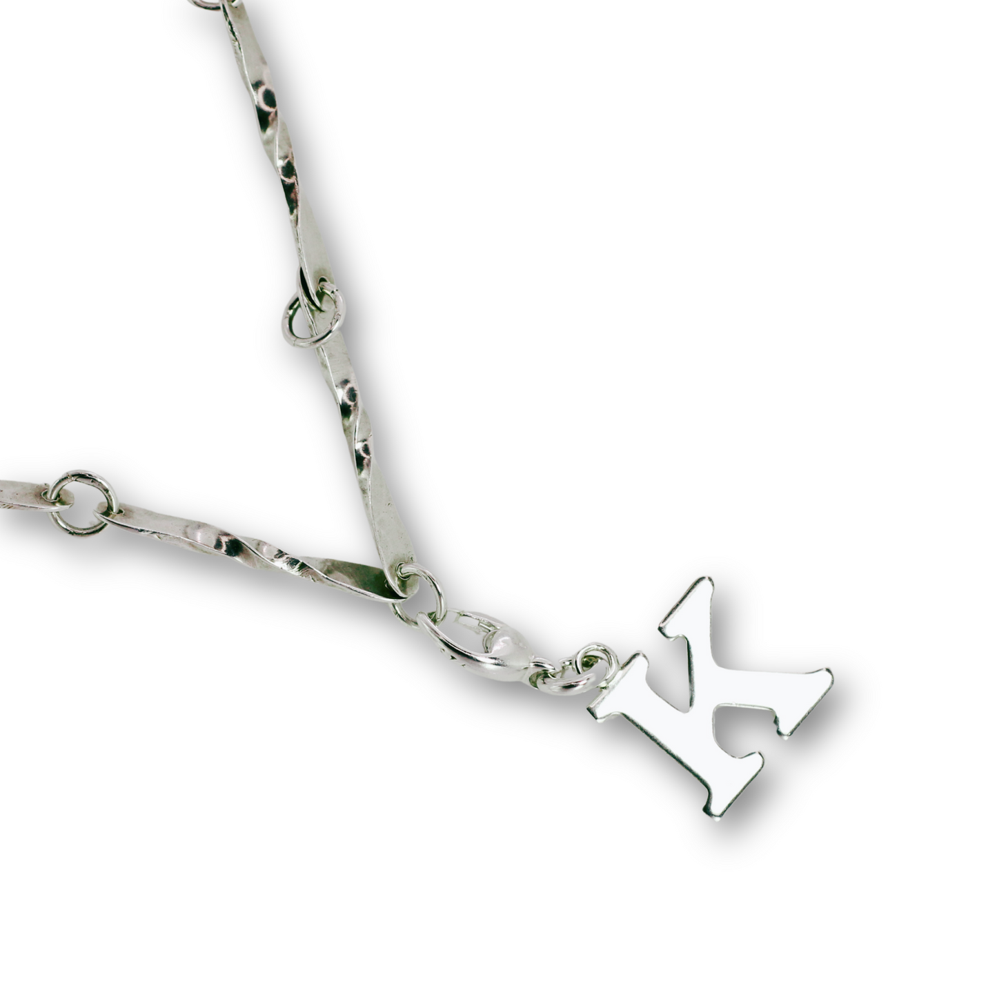 Handcrafted sterling silver letter K clip-on charm by Vijara jewelry.