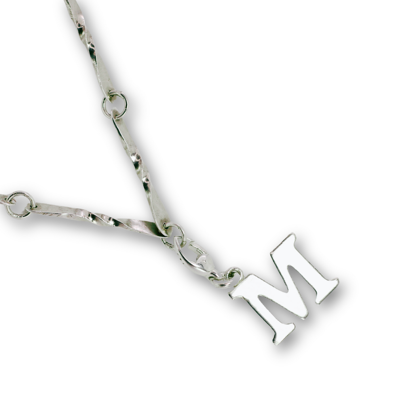 Handcrafted sterling silver letter M clip-on charm by Vijara jewelry.