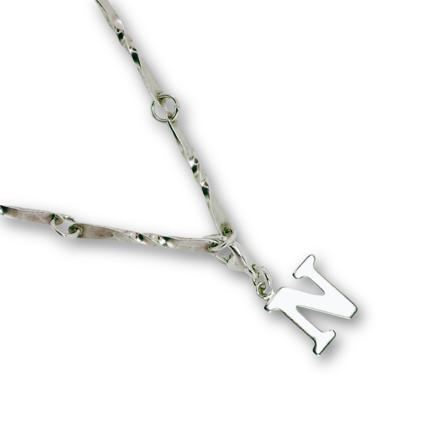 Handcrafted sterling silver letter N clip-on charm by Vijara jewelry.