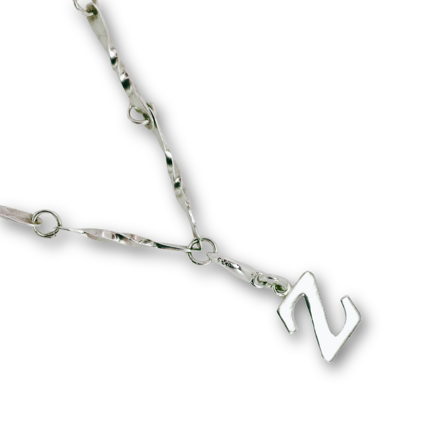 Handcrafted sterling silver letter Z clip-on charm by Vijara jewelry.