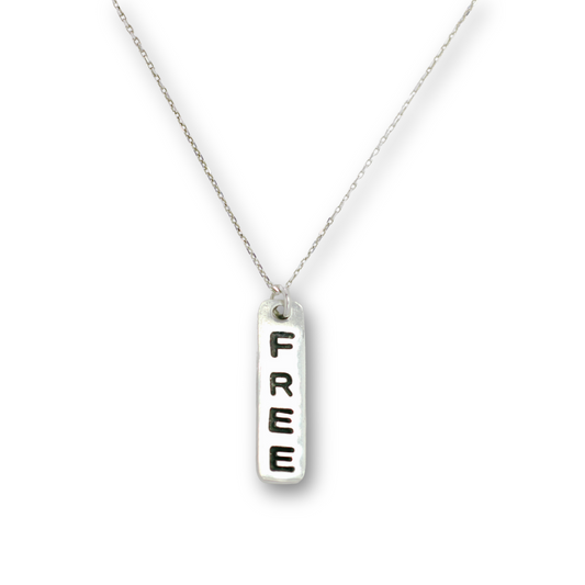 Handcrafted recycled fine silver "free" word charm necklace by Vijara jewelry.