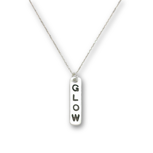 Handcrafted recycled fine silver "glow" word charm necklace by Vijara jewelry.