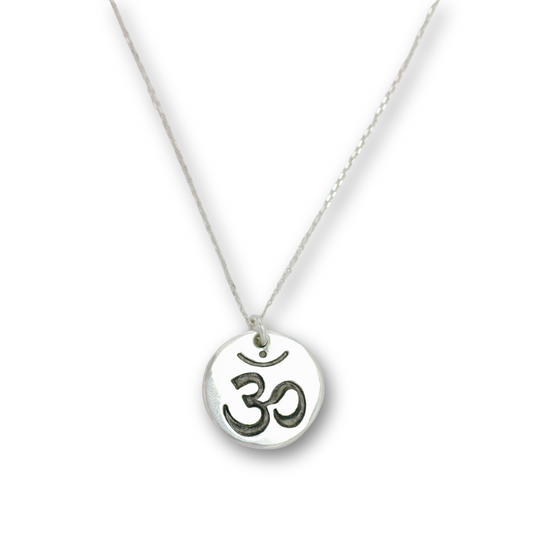 Handcrafted recycled fine silver yoga om charm necklace by Vijara jewelry.