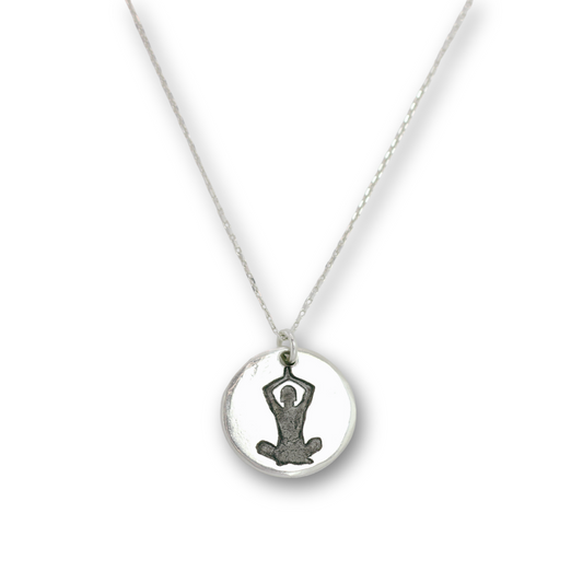 Handcrafted recycled fine silver yoga seated meditation charm necklace by Vijara jewelry.