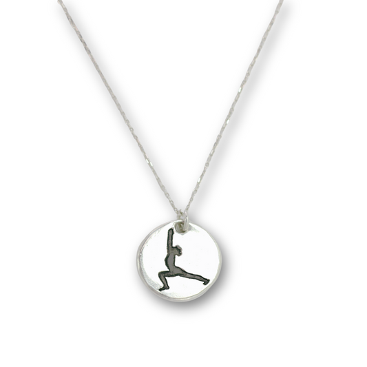 Handcrafted recycled fine silver yoga warrior pose charm necklace by Vijara jewelry.