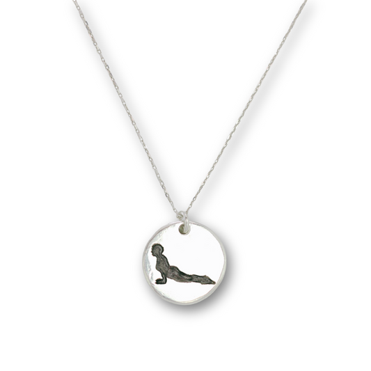 Handcrafted recycled fine silver yoga cobra pose charm necklace by Vijara jewelry.