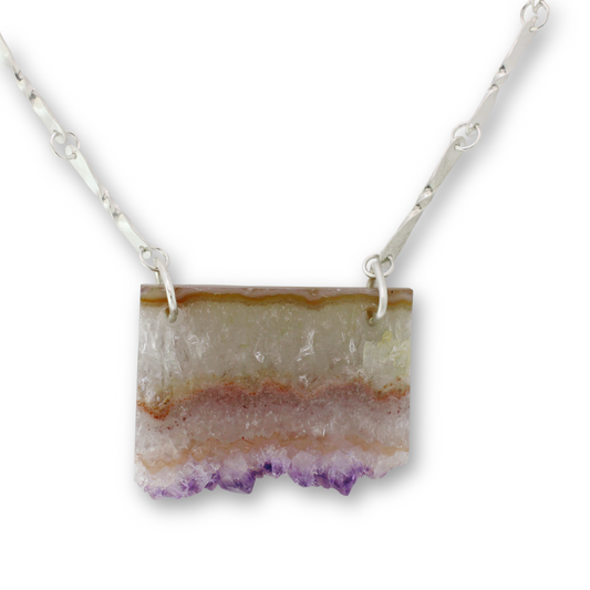 Handcrafted sterling silver chain with natural amethyst slice centerpiece by Vijara jewelry.